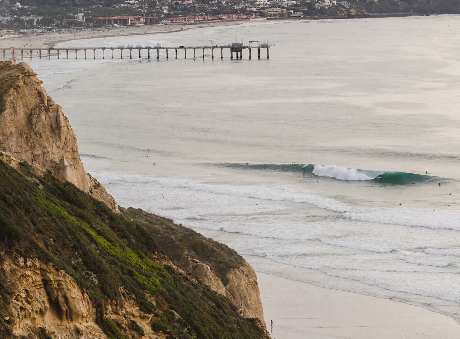 Less crowded San Diego beaches featuring Black's Beach in La Jolla with surfers in the water