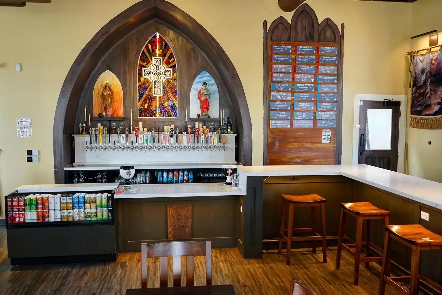 Interior of San Diego brewery The Church by The Lost Abbey located in East Village downtown with church decorations at the bar