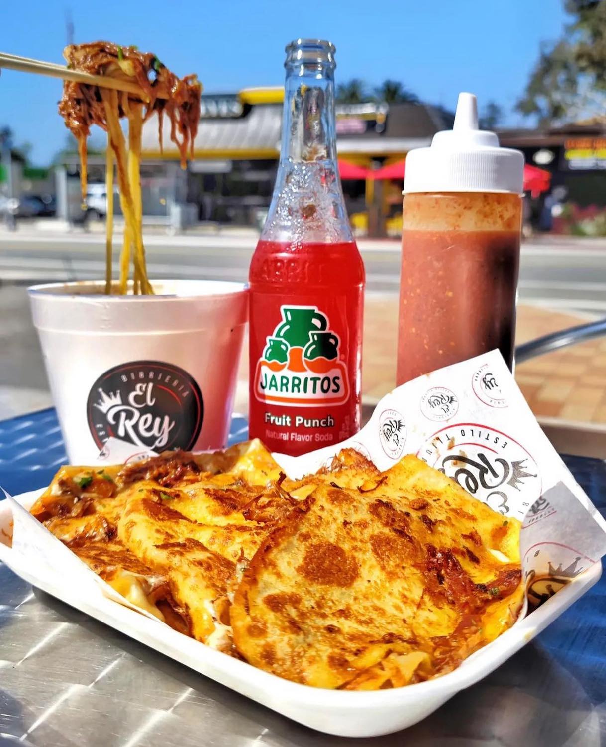 Food from San Diego food truck Birria El Rey in Golden Hill featuring Quesabiria and birria ramen 