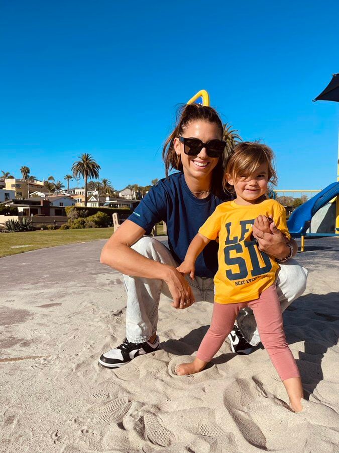 Alex Morgan and daughter at beach