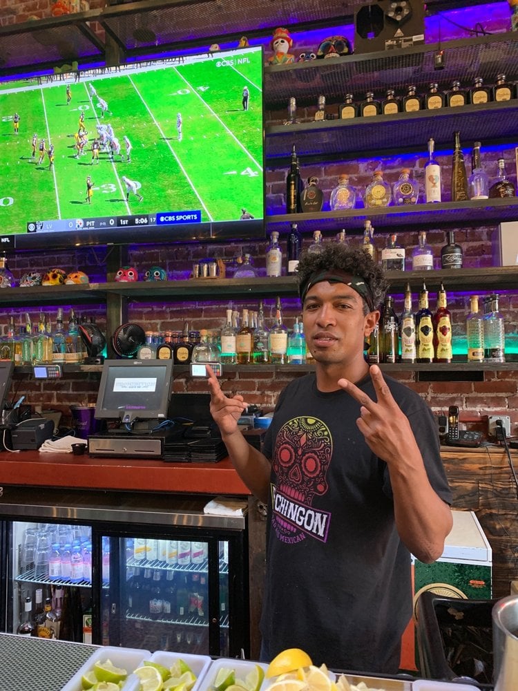 Interior of San Diego sports bar El Chingon where NFL fans watch Last Vegas Raiders football games in the Gaslamp Quarter