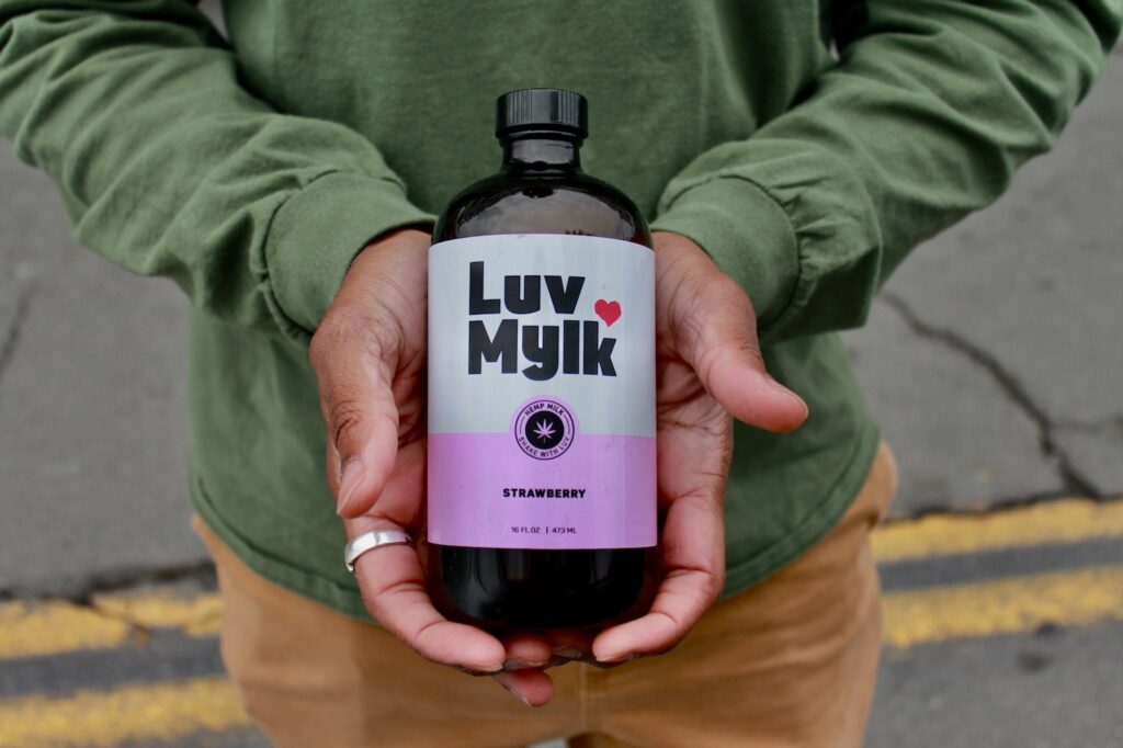 Luv Mylk Alternative Milk in Founder Vincent Dotson's hands