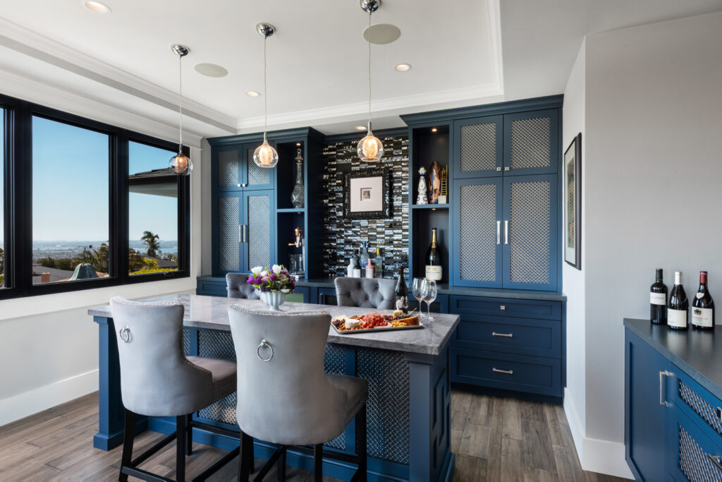 San Diego interior designer Lisa Franco's home bar with stools and wine cabinets in her home 