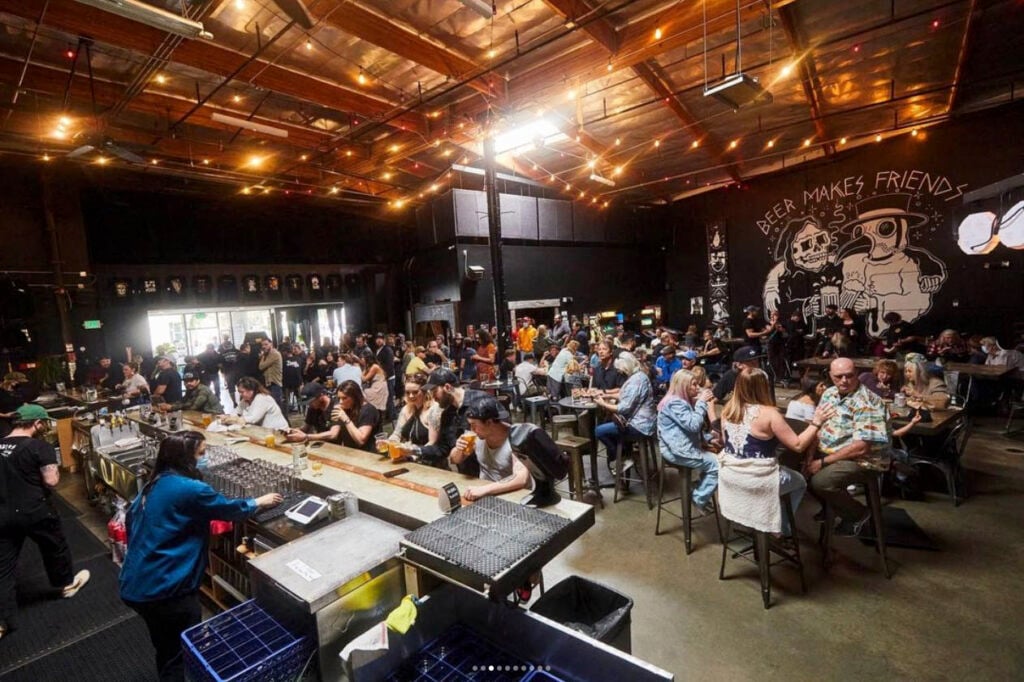 Interior of Black Plague Brewing with customers playing trivia