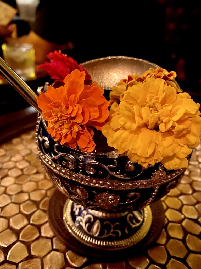 The Garden of Death ornamental cocktail with flowers on-top from Oculto 477 in Old Town San Diego