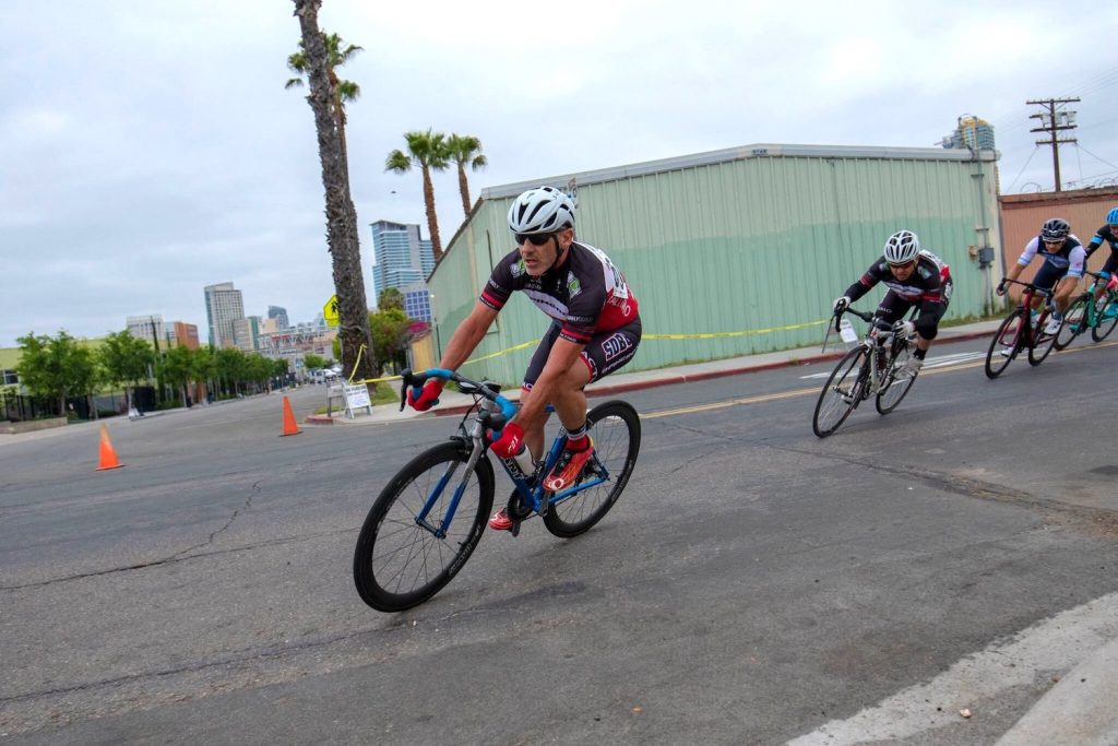 Cyclists rounding a corner in the Barrio Logan Grand Prix 
