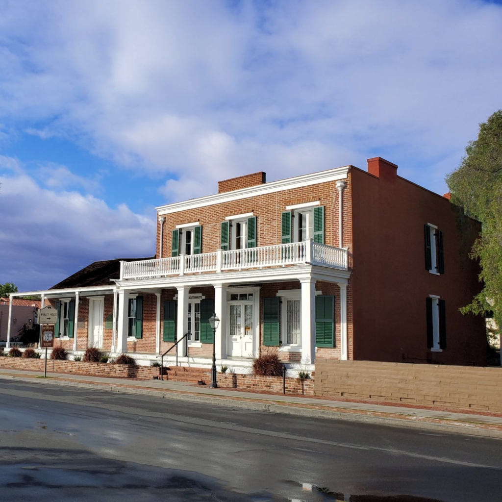 Exterior of the brick exterior Whaley House in Old Town, one of San Diego's most haunted places
