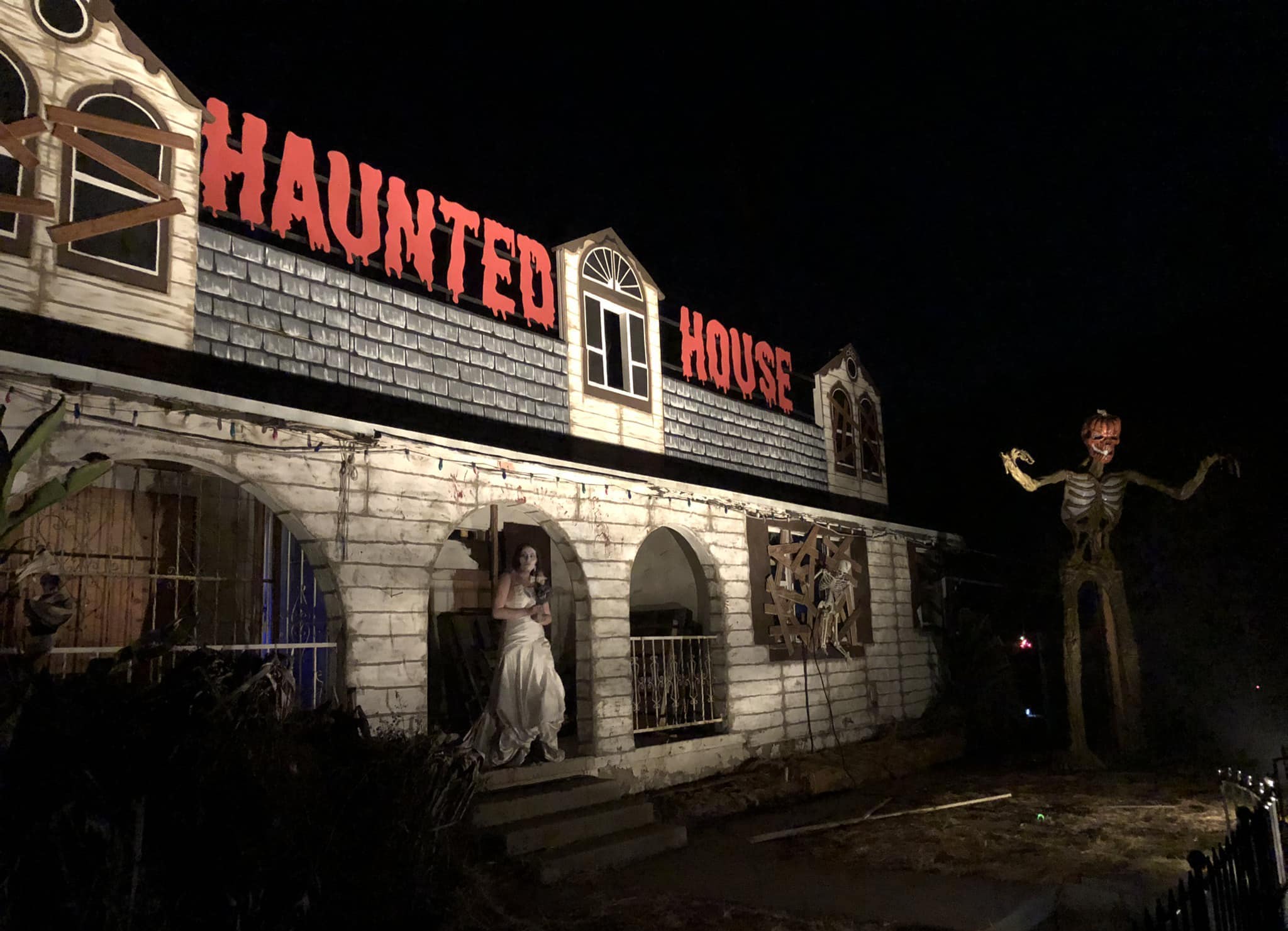 Attraction with a sign "Haunted House" at the Haunted Amusement Park or Scare Trail in San Diego