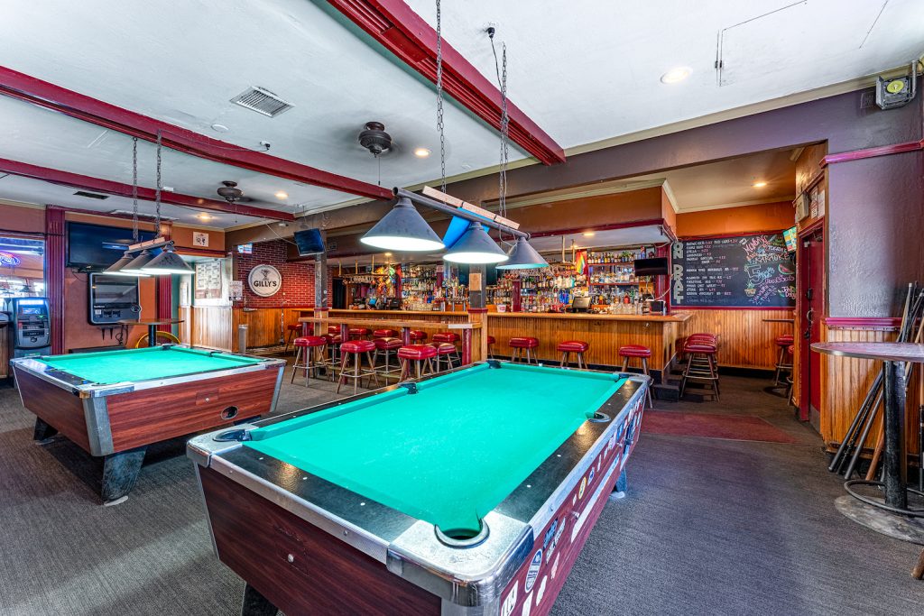 Interior of Gilly's House of Cocktails featuring a billiards table and