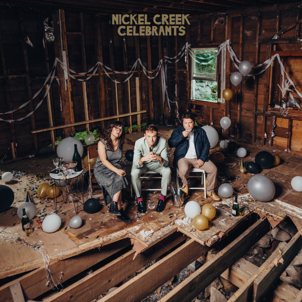 Nickel Creek’s Celebrants album cover featuring the three members having a party in an abandoned home