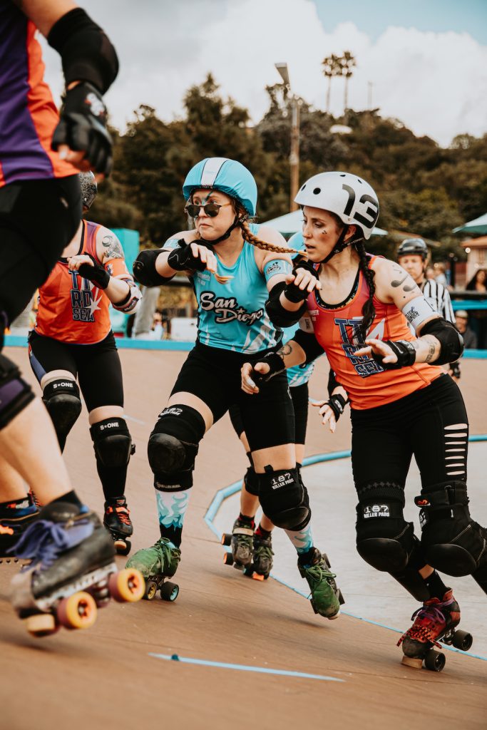 Roller derby players collide on the rink during a San Diego Wildfires bout