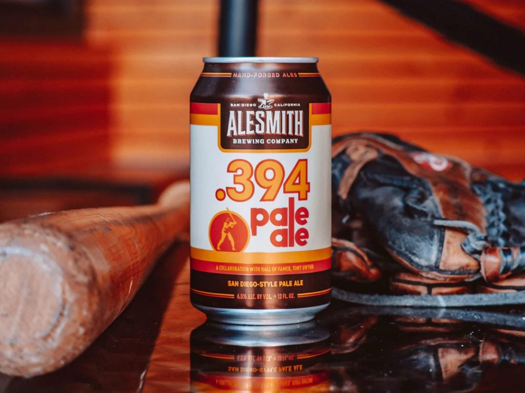 .394 Pale Ale Beer can surrounded by baseball bat  and glove from AleSmith Brewing Company 