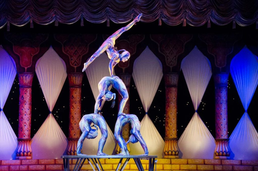 Contortionists on stage performing for the Cirque Dreams Holidaze at the San Diego Civic Theatre