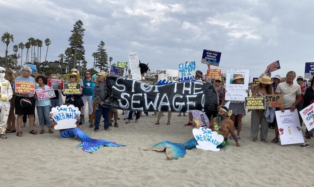Protesters gather at Coronado Beach in San Diego to push for action regarding the sewage crisis