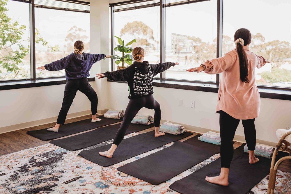 Members of Monima Wellness Center participate in a Yoga class