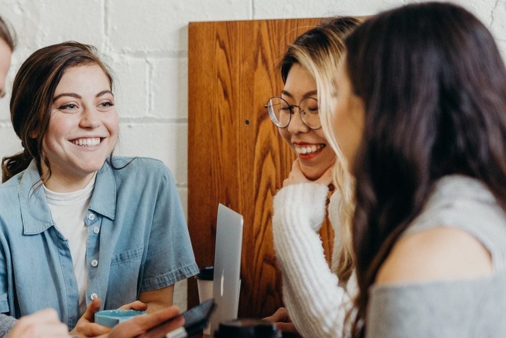 Three women conversing during a mental health session at Monima Wellness Center in San Diego