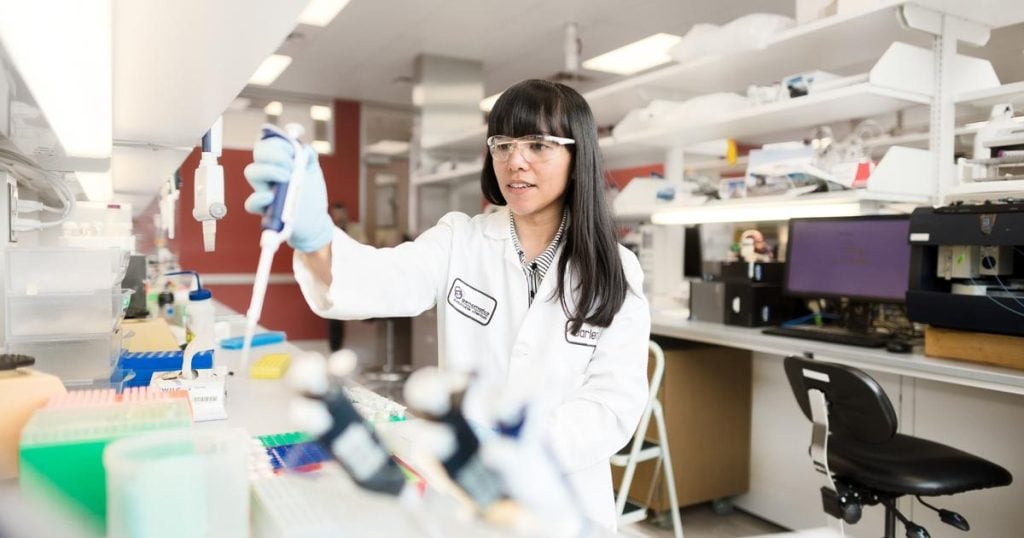 Genomatica scientists mixing chemicals in a lab