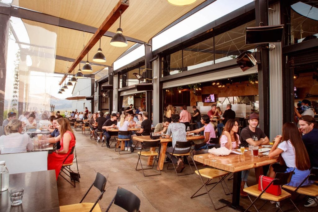 Large groups of people eating and drinking at Viewpoint Brewing in Del Mar 