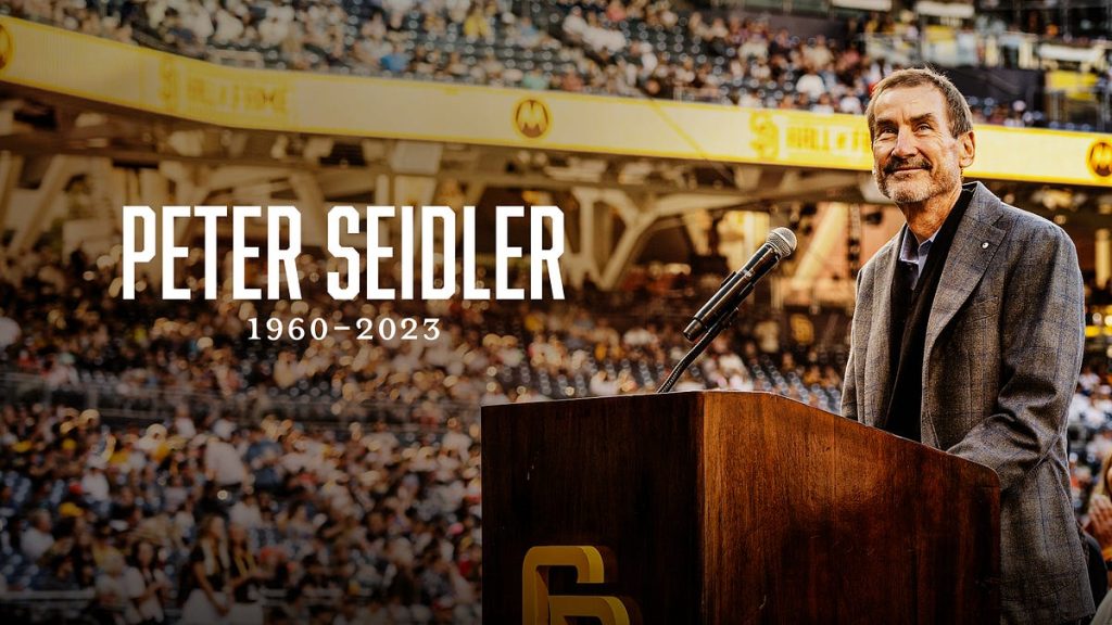 San Diego Padres owner Peter Seidler  standing at a podium at Petco Park 
