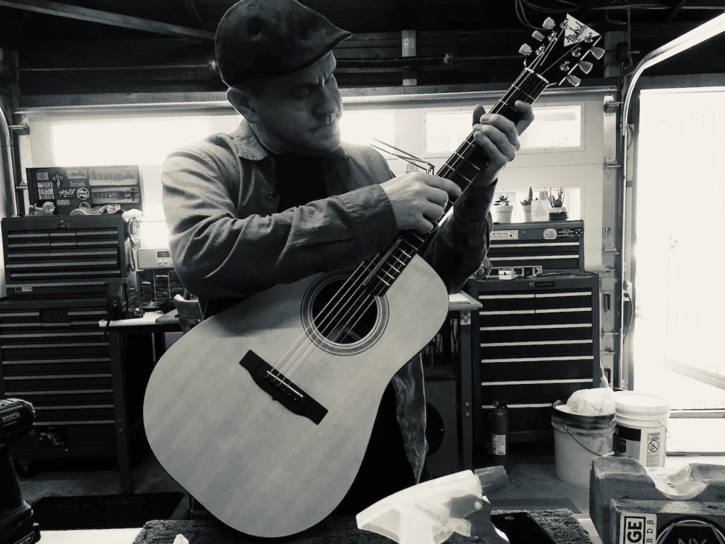 San Diego Master luthier Brandon Madrid building an acoustic guitar in his workshop in Allied Gardens