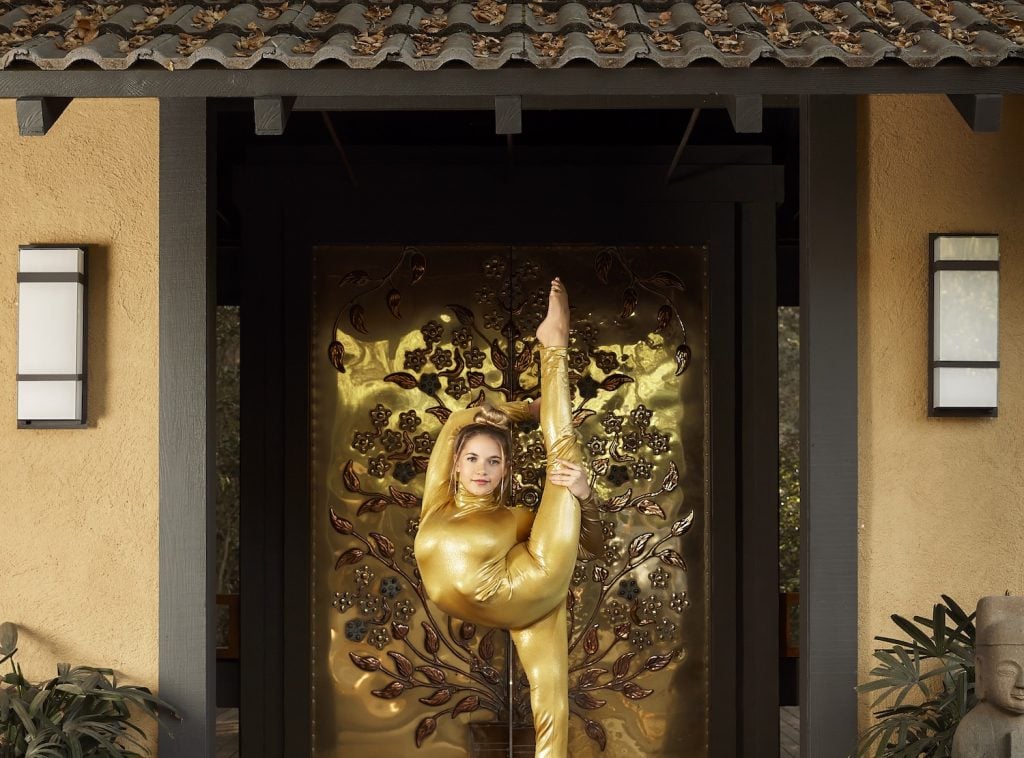 San Diego contortionist Emerald Gordon Wulf posing in front of Gold Door spa in San Diego