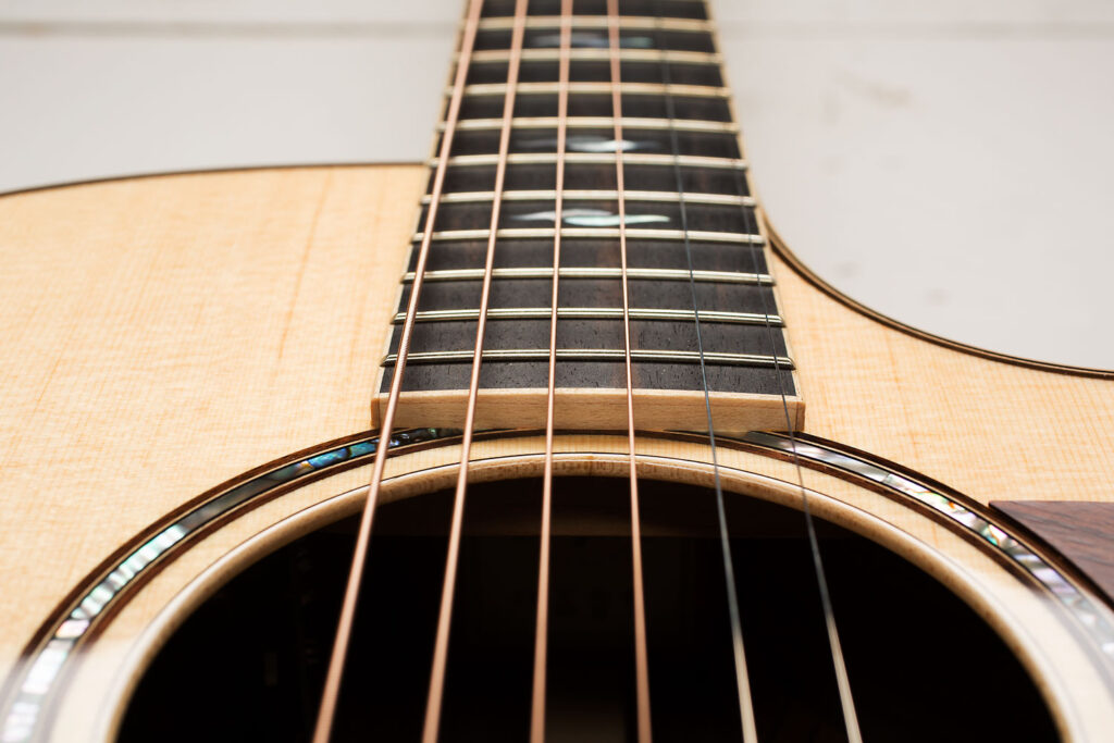 Close-up shot of an acoustic guitar from Taylor Guitars