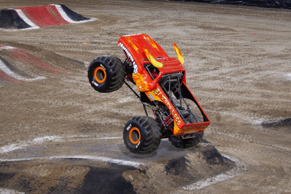 El Toro Loco monster truck doing a wheelie on a ramp at the 2024 Monster Jam event at Snapdragon Stadium