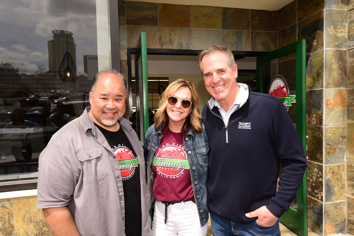 Mary Benirschke and her husband Rolf Benirschke alongside the owner of Timmy's Pizza a pizza shop in San Diego giving jobs to homeless and underprivileged youth