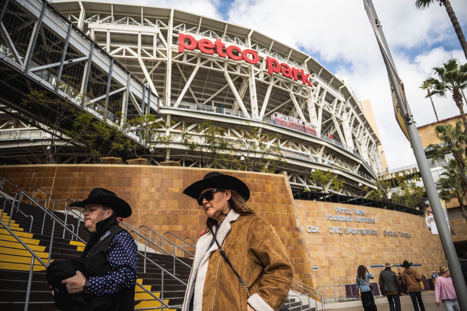 The 2024 San Diego Rodeo at Petco Park featuring two attendees wearing cowboy hats