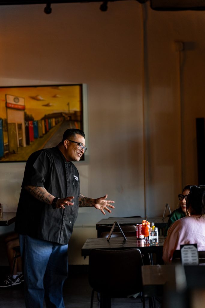 Angel Muñoz, manager at The Balboa South, offers an amiable lecture on fine burgers