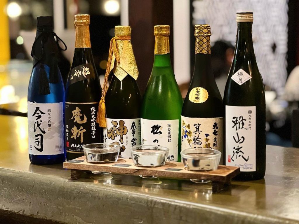 San Diego's best sake bar, Tanuki sake bar, located in Kensington featuring several exported bottles of Japanese rise wine and glasses