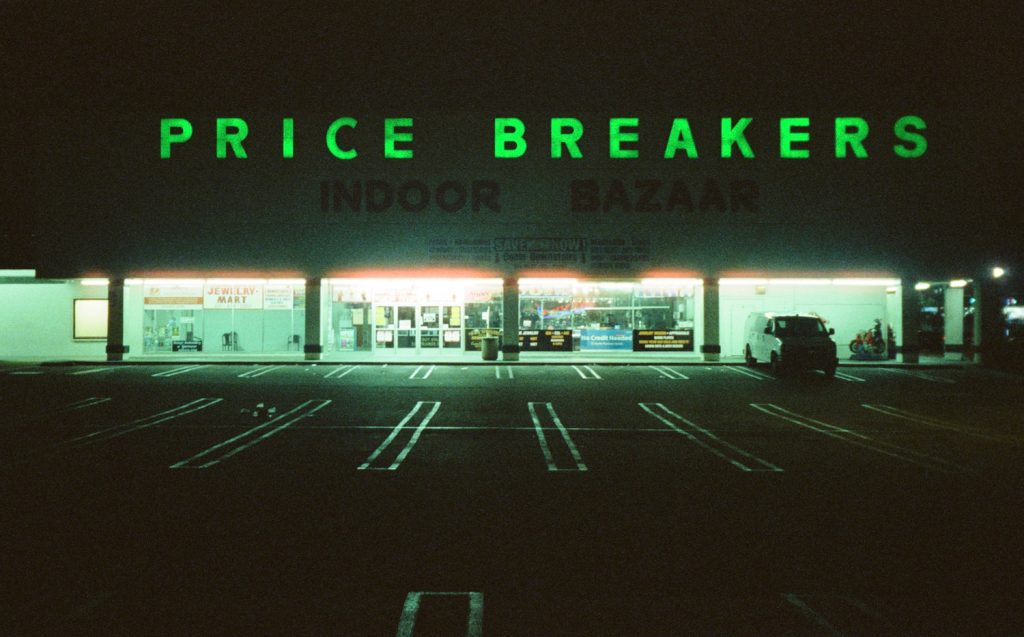 Film photo of Price Breakers shopping center at night in National City, San Diego by 619 Gurlz photographer Gina Serna-Rosas