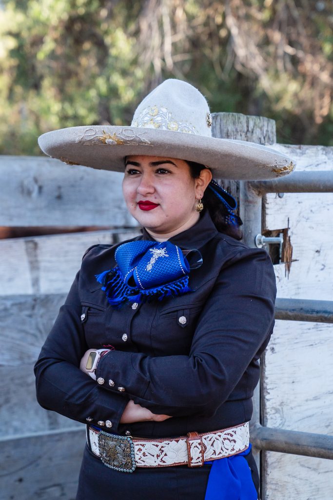 Escaramuza team Las Reynas del Sol’s coach Neftali Aquino wearing a traditional outfit and Mexican hat