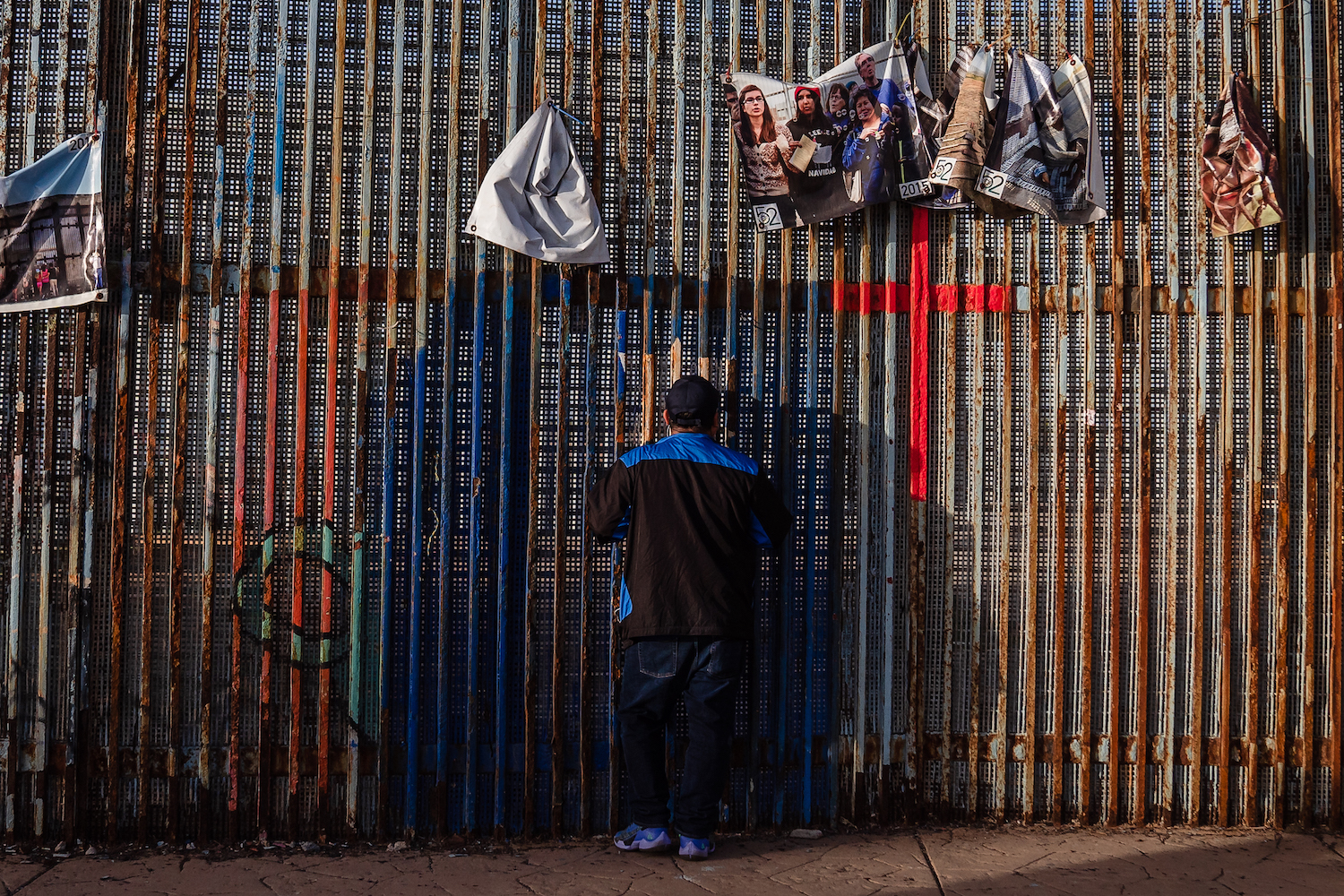 Man at Friendship Park on the Tijuana San Diego US-Mexico border looking at the new border wall