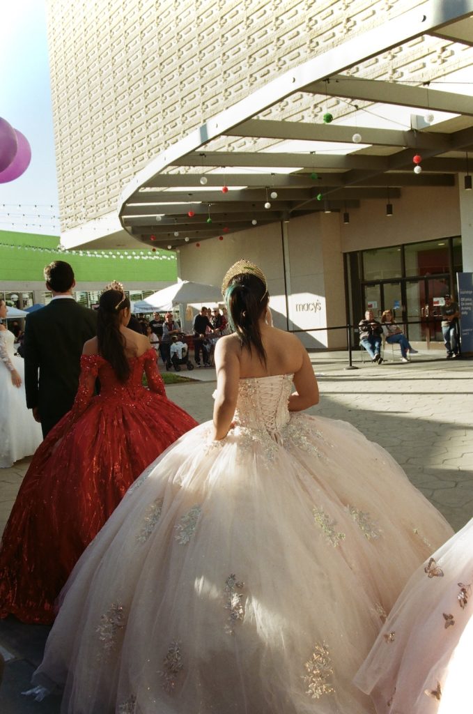 Film photo of a girl in a traditional mexican quinceañera dress at the Chula Vista Mall in San Diego's South Bay by 619 Gurlz photographer Delana Delgado