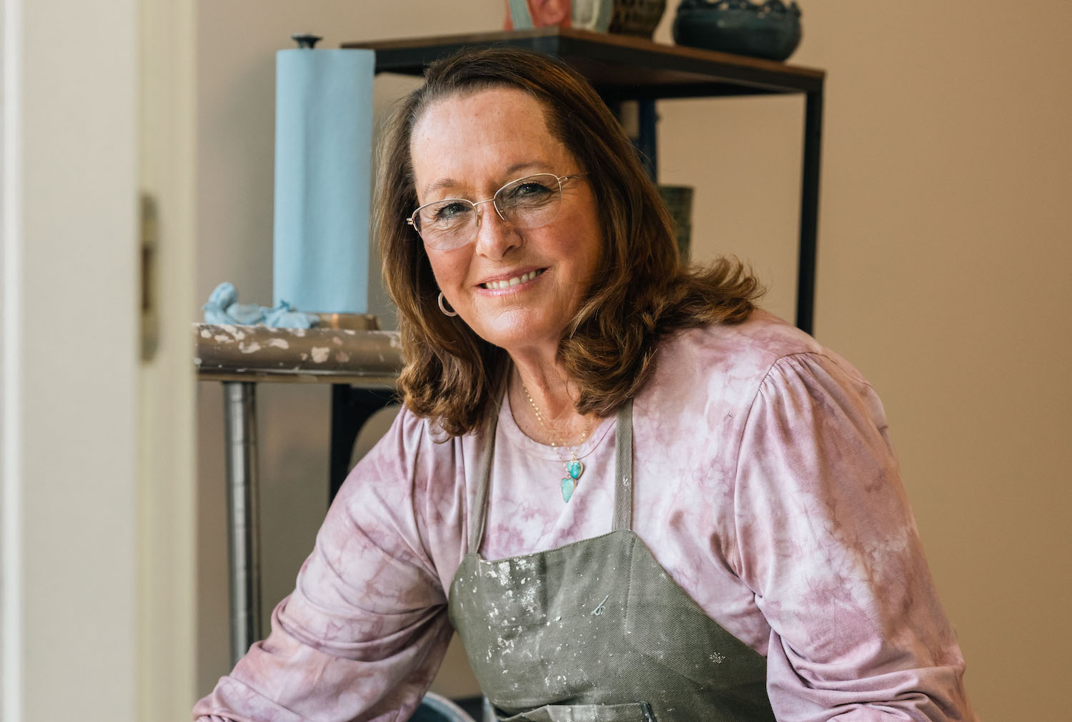 Marcia Johnson, founder of the OURS Art Foundation, a San Diego nonprofit focused on helping victims of trauma through art therapy, in her pottery studio