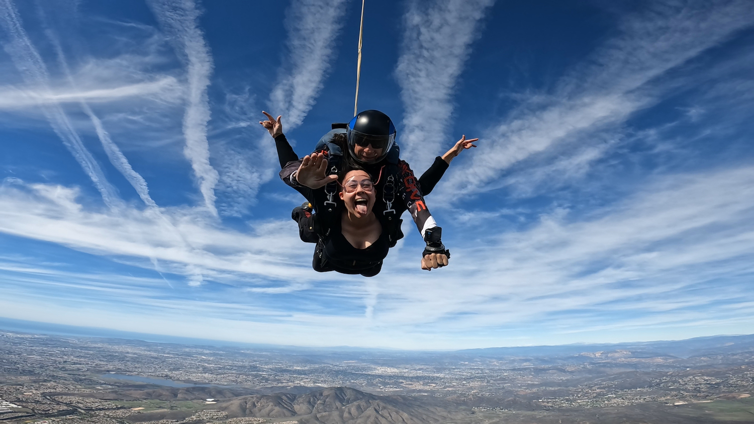 University City High School teacher Nia Hilton free-falling after skydiving with San Diego Magazine in Otay Lakes