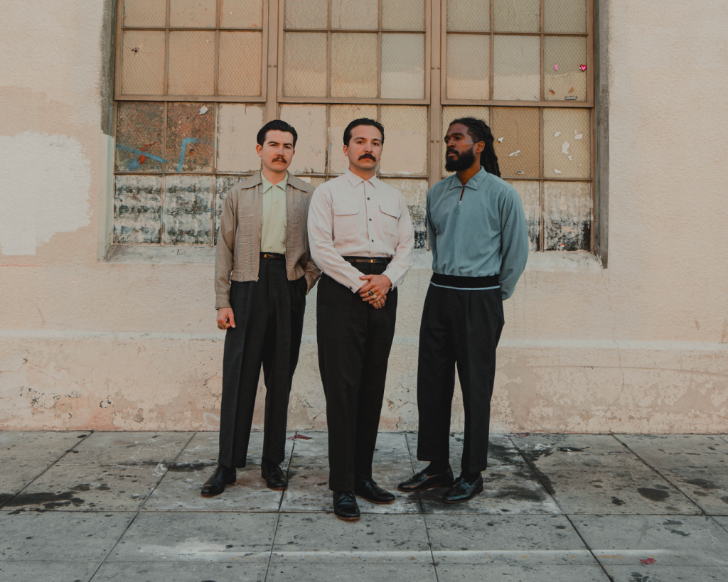 San Diego South Bay soul band Thee Sacred Souls standing in front of a building downtown