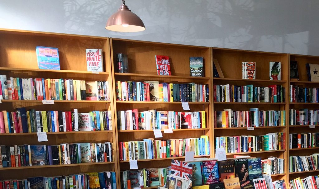 Interior of San Diego bookstore The Book Catapult located in South Park featuring rows of books with reviews