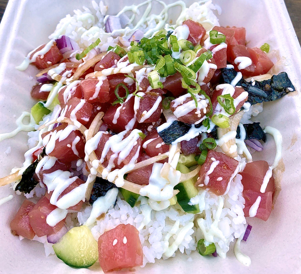 Salmon and tuna poke bowl from hawaiian restaurant Chris’ Ono Grinds Island Grill in San Diego