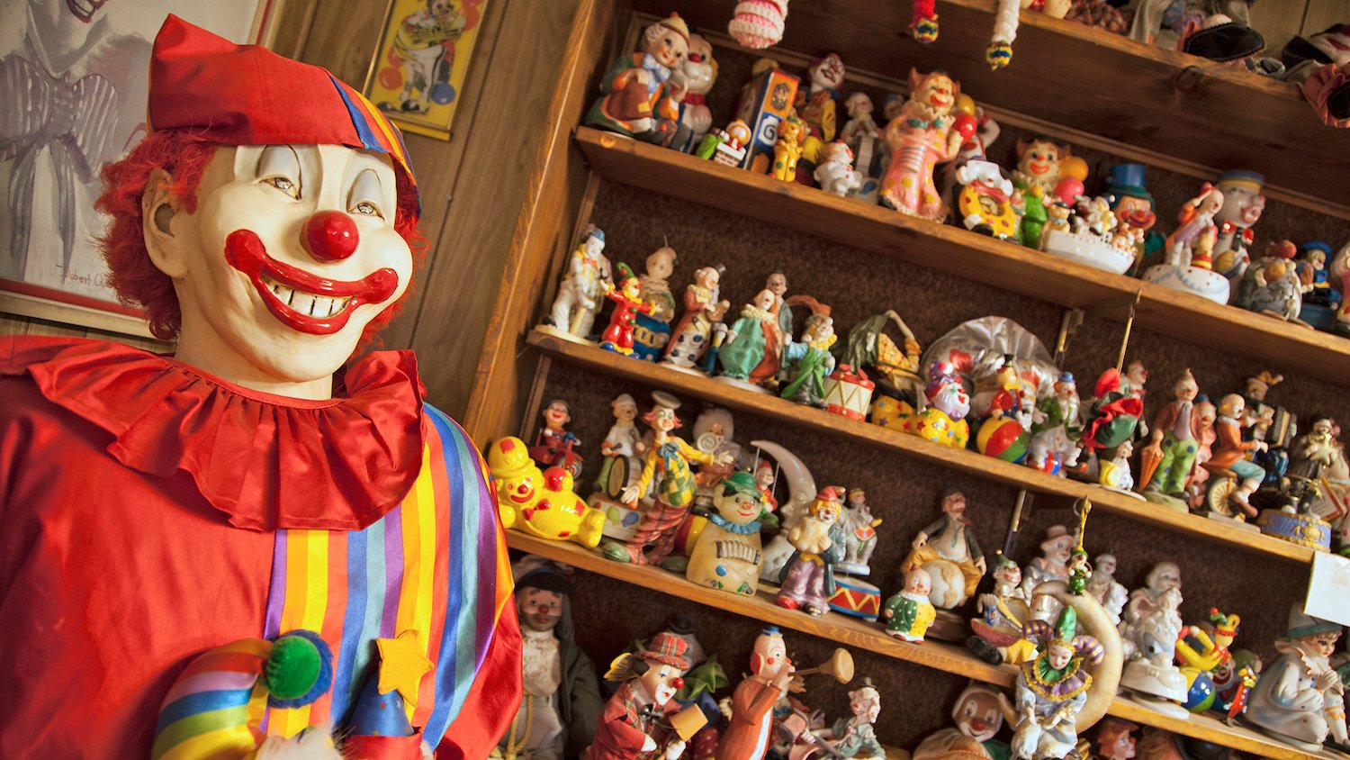Interior of the clown motel in Tonopah, Nevada featuring clown collectible figurines on a shelf