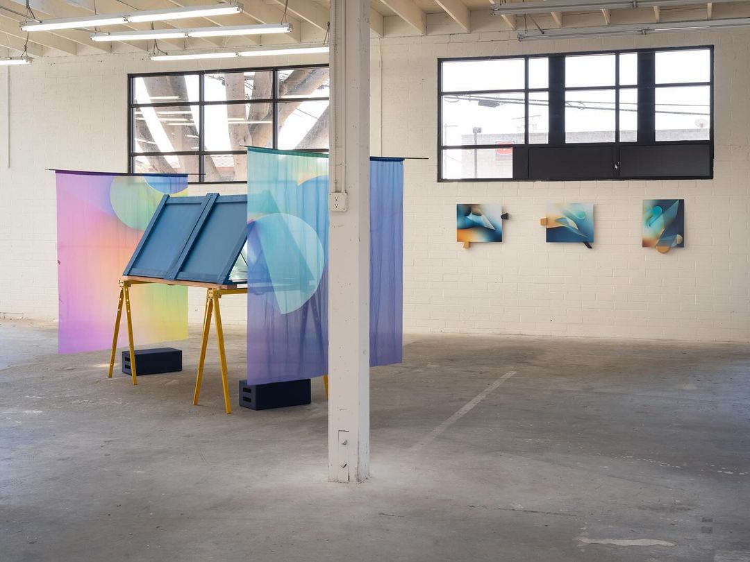Interior of Oolong Gallery in Encinitas featuring a colorful modern art in a warehouse
