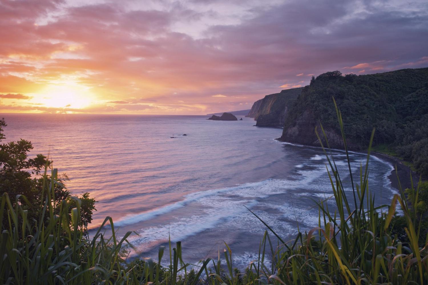 Big Island of Hawaii things to do including the Pololu Valley Hike featuring a view from the cliffs at sunset