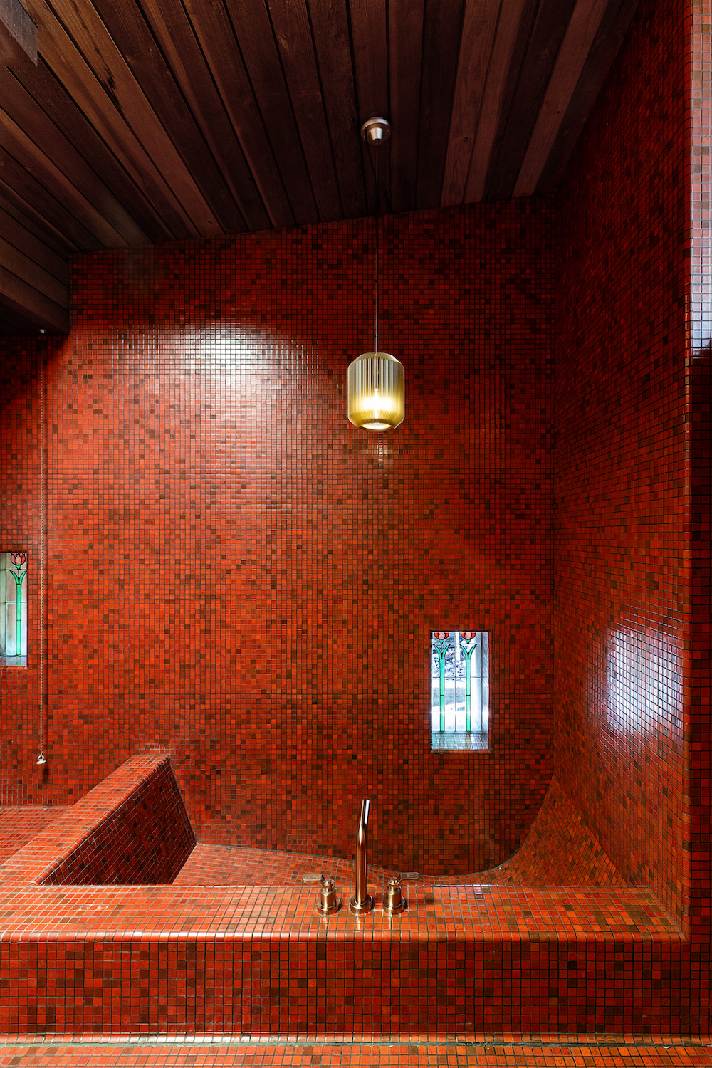 Interior of San Diego designers Paul Basile and Jules Wilson's La Jolla home designed by Frederick Charles Liebhardt featuring a red tile bathtub