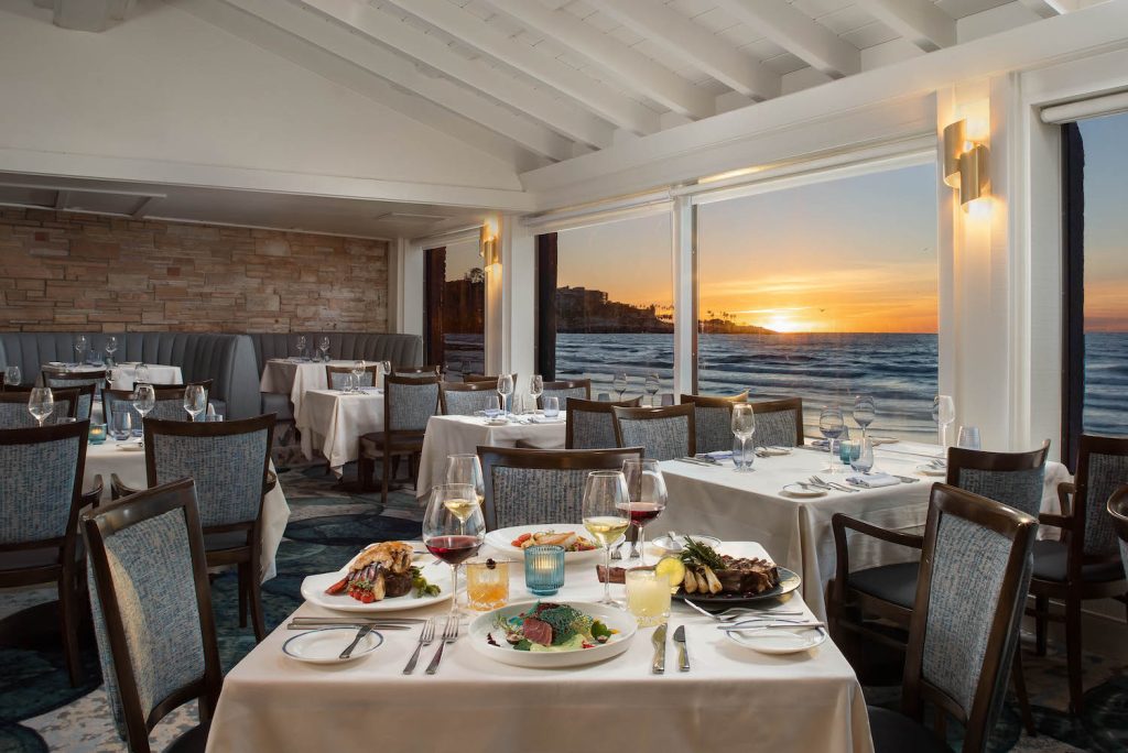 Interior of The Marine Room overlooking the beaches of La Jolla offering a 2024 Easter dinner special