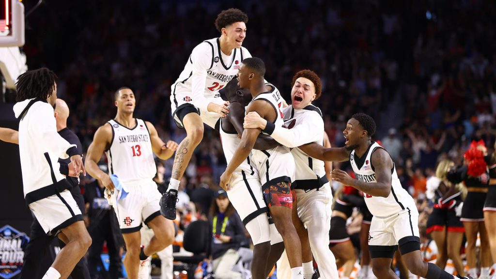 The 2023 San Diego State Aztecs celebrating during the NCAA March Madness Basketball tournament after a win
