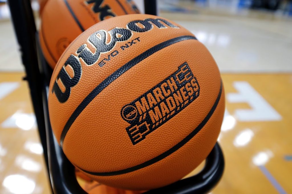 2024 NCAA March Madness basketballs with the official logo featuring where to watch or stream the live games