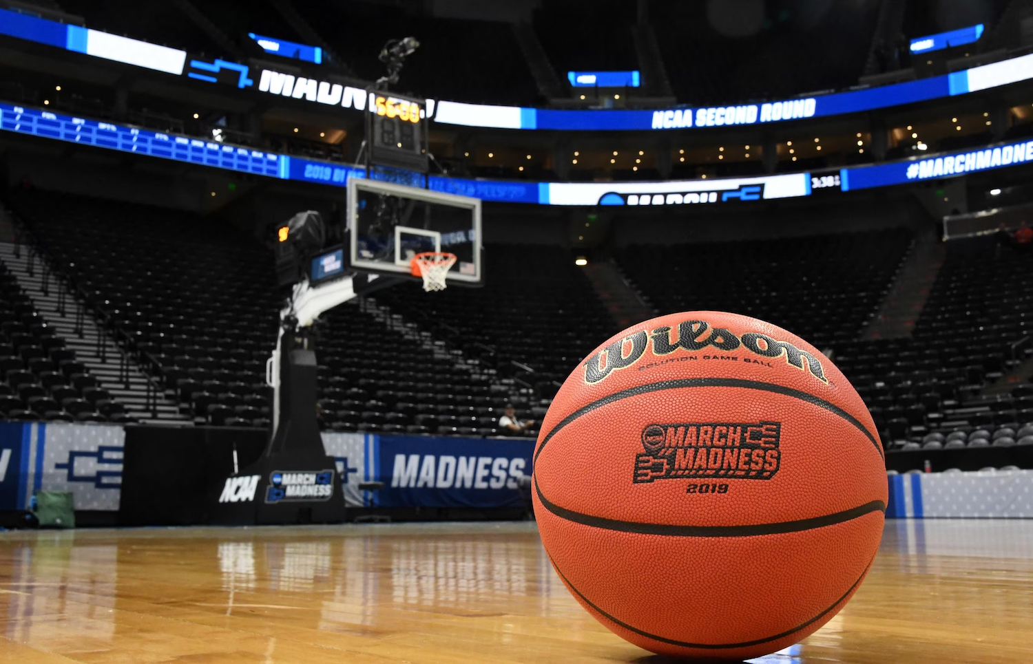 The 2024 NCAA March Madness Basketball tournament featuring a basketball on a court before a game