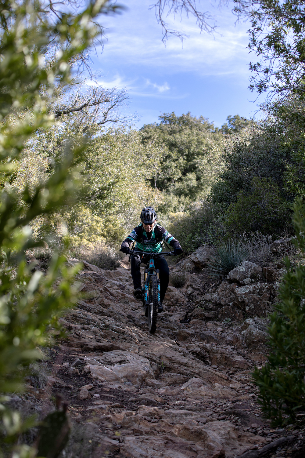 James Murren mountain bikes over rocky terrain near Laguna Mountain, San Diego