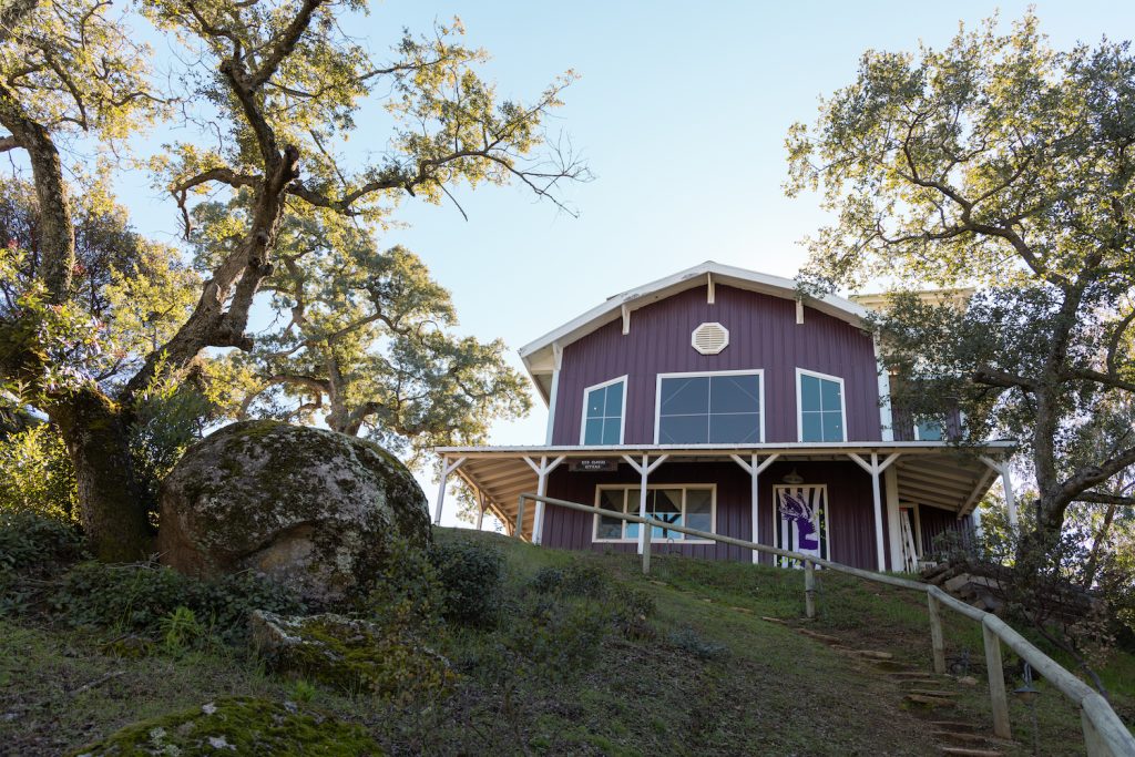 Exterior of Gold Dust Collective founders home in Jamul reminiscent of a red barn 